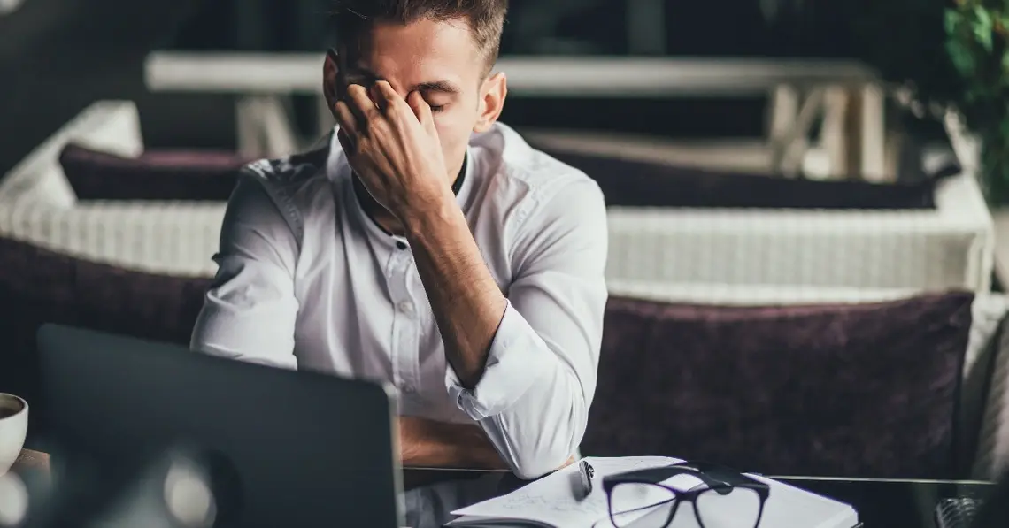 Frustrated employee dealing with business insurance issues